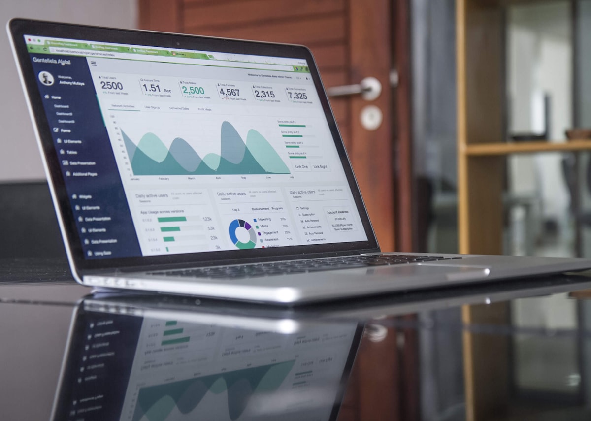Laptop with scattered dashboards and metrics before one connected invoicing and cash view