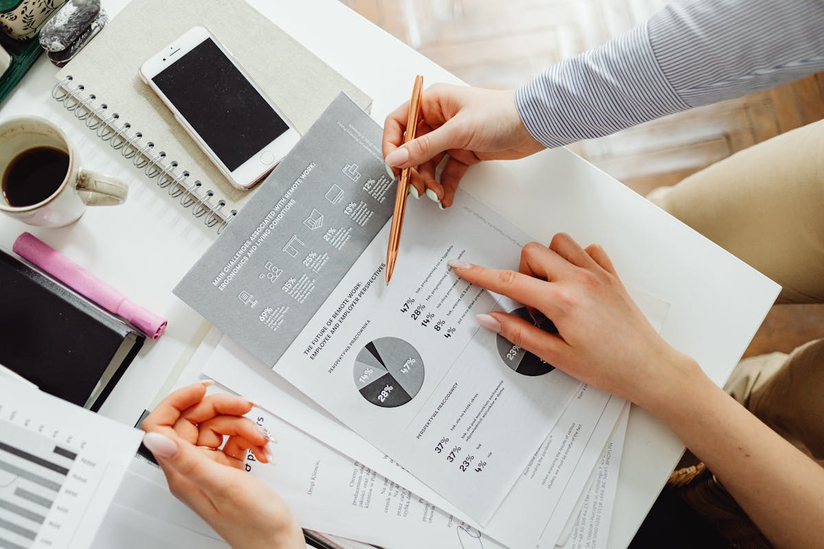 Professionals reviewing financial reports and metrics together at a desk